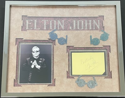 Lot 70 - ELTON JOHN - SIGNED PAGE IN FRAMED DISPLAY.