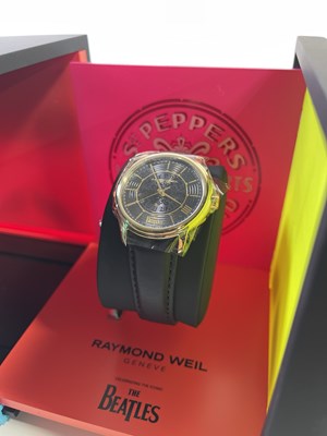 Lot 168 - THE BEATLES - RAYMOND WEIL SGT, PEPPER'S WATCH IN ORIGINAL BOX AND PACKAGING.