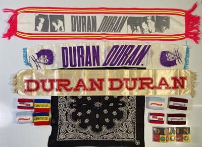 Lot 519 - DURAN DURAN - ORIGINAL PATCHES / PIN BADGES / CONCERT SCARF COLLECTION.