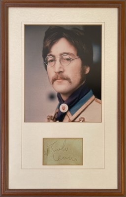 Lot 360 - JOHN LENNON - SIGNED PAGE IN FRAMED DISPLAY.