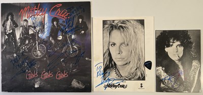 Lot 415 - MOTLEY CRUE SIGNED LP AND VINCE NEIL PHOTO.