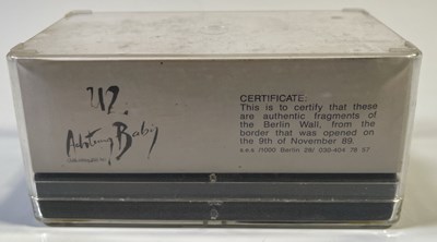 Lot 265 - U2 ACHTUNG BABY - PIECE OF BERLIN WALL IN TRABANT DISPLAY.