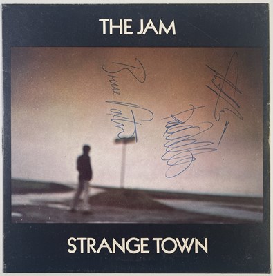 Lot 463 - THE JAM - FULLY SIGNED COPY OF STRANGE TOWN.