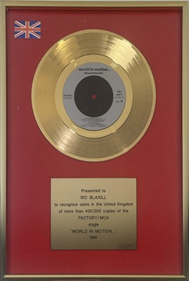 Lot 478 - NEW ORDER - OFFICIAL GOLD DISC FOR 'WORLD IN MOTION'.