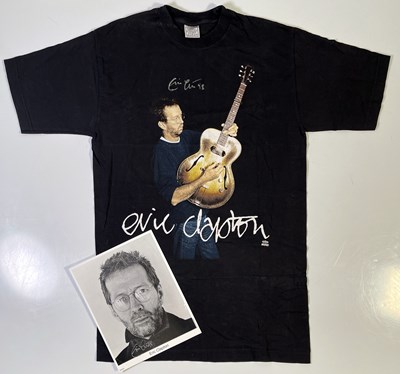 Lot 411 - ERIC CLAPTON - SIGNED T-SHIRT AND PHOTO.