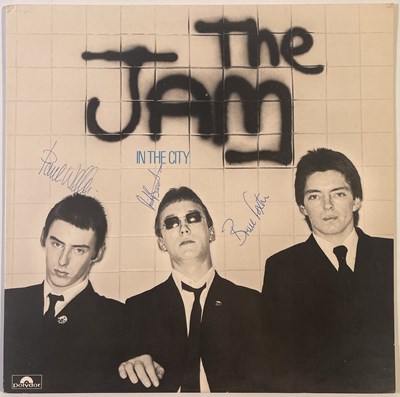 Lot 96 - THE JAM - A FULLY SIGNED COPY OF 'IN THE CITY'.