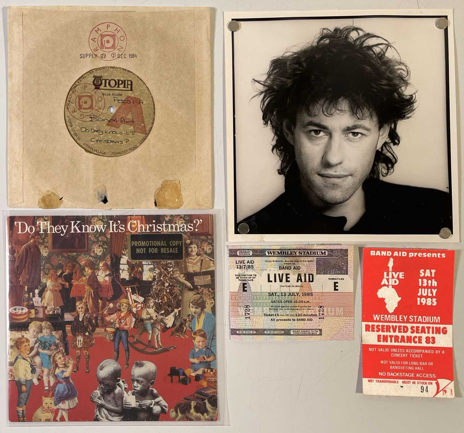 Lot 557 - BAND AID / LIVE AID - ORGINAL ACETATE AND LIVE AID MEMORABILIA.