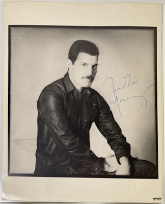 Lot 462 - QUEEN - FOUR SIGNED PHOTOGRAPHS INC FREDDIE MERCURY.