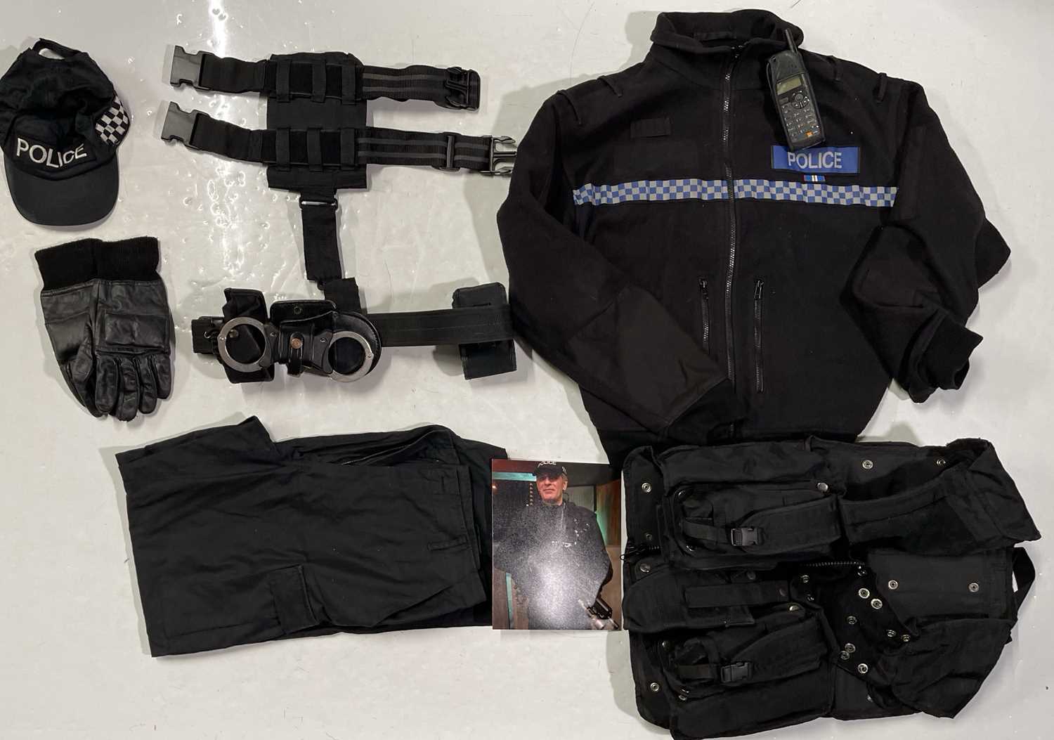 Lot 229 - PROPS AND PRODUCTION USED ITEMS INC ATTACK THE BLOCK POLICE COSTUME.