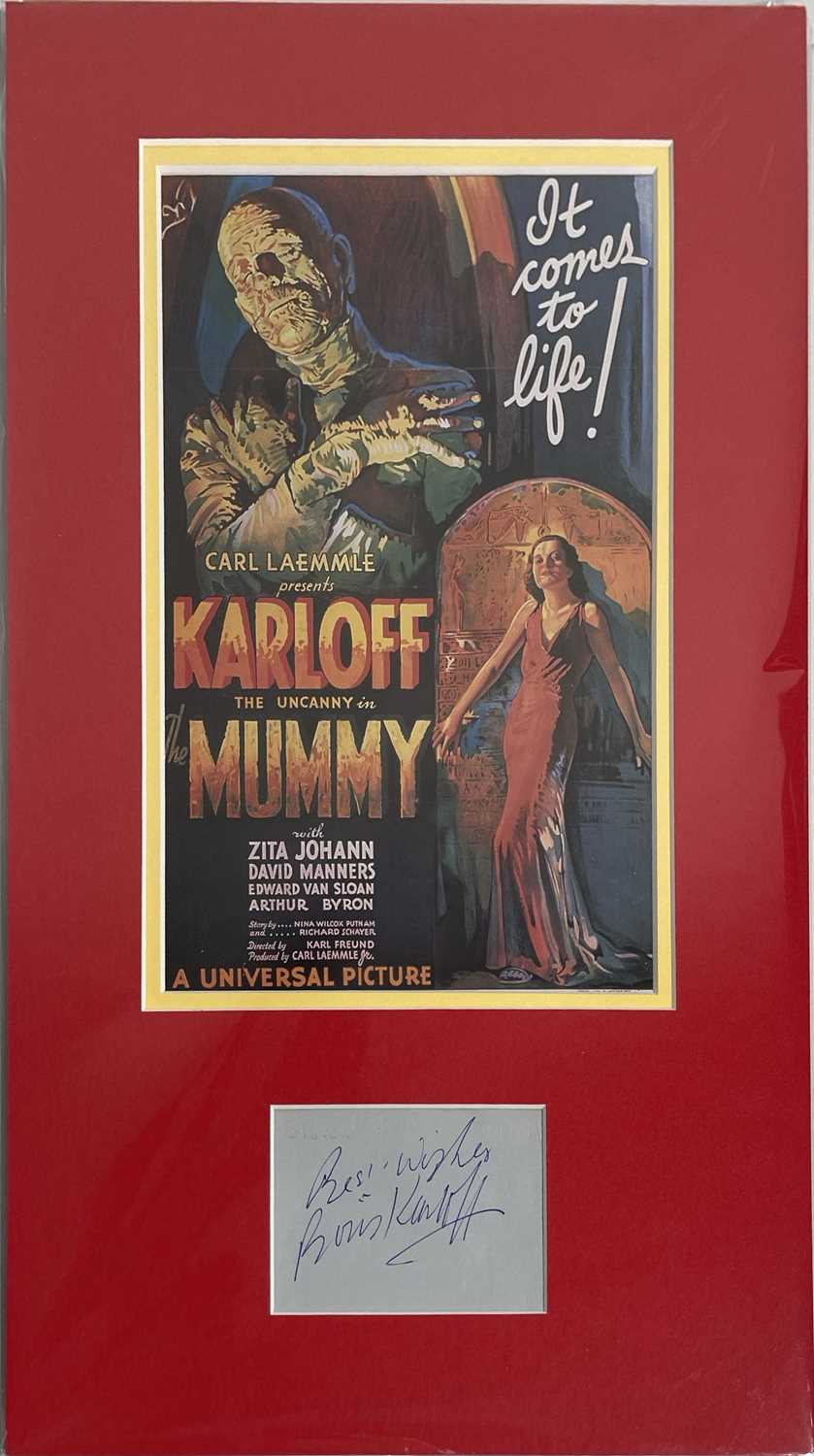 Lot 61 - BORIS KARLOFF - SIGNED PAGE IN MOUNTED DISPLAY.