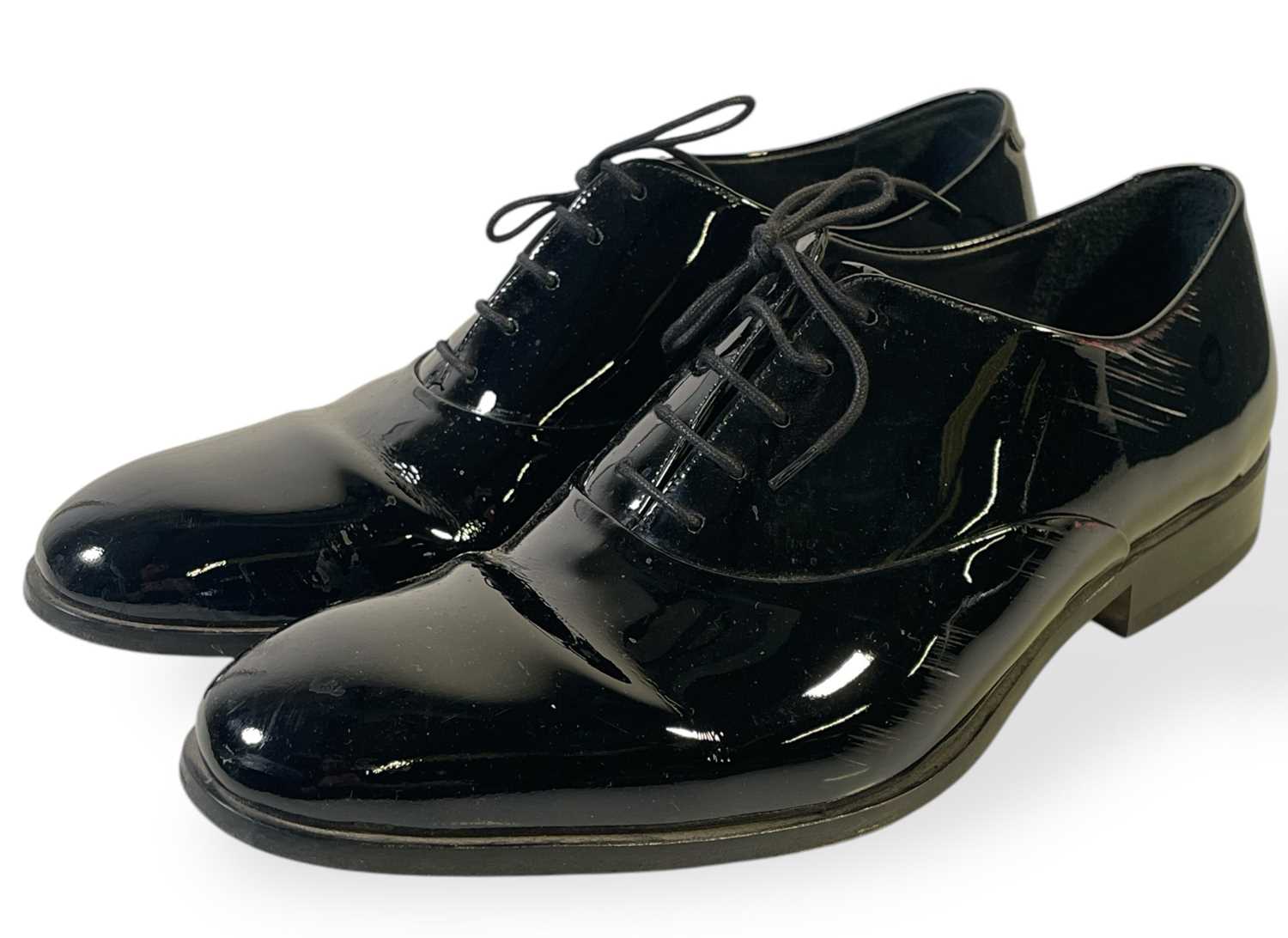 Lot 33 - PEAKY BLINDERS - PACKY LEE AS JOHNNY DOGS - LIKELY SCREEN WORN PATENT LEATHER LOAFERS.
