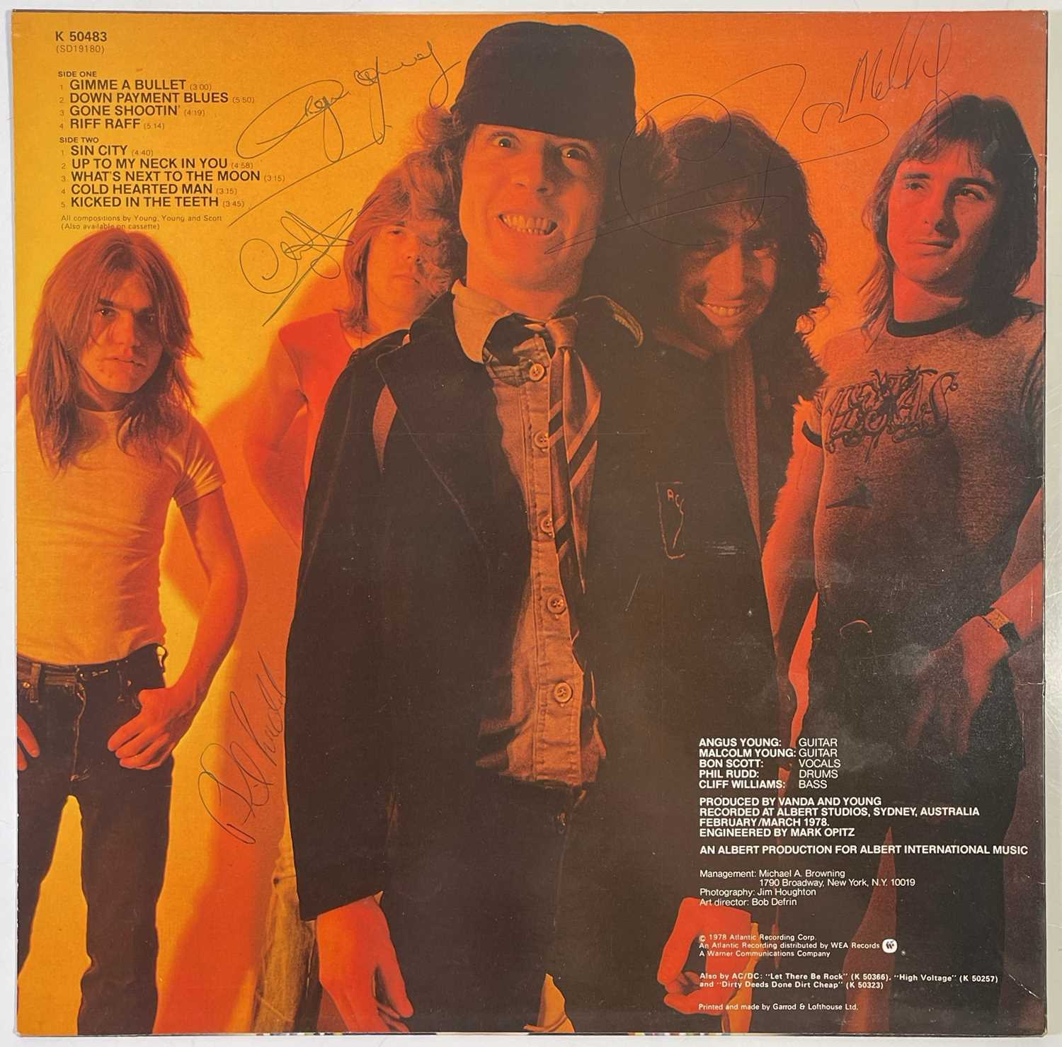 Lot 209 - AC/DC - COPY OF POWERAGE SIGNED TO FRONT AND BACK OF SLEEVE.