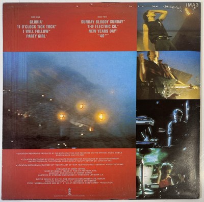 Lot 442 - U2 - SIGNED COPY OF 'UNDER A BLOOD RED SKY'.