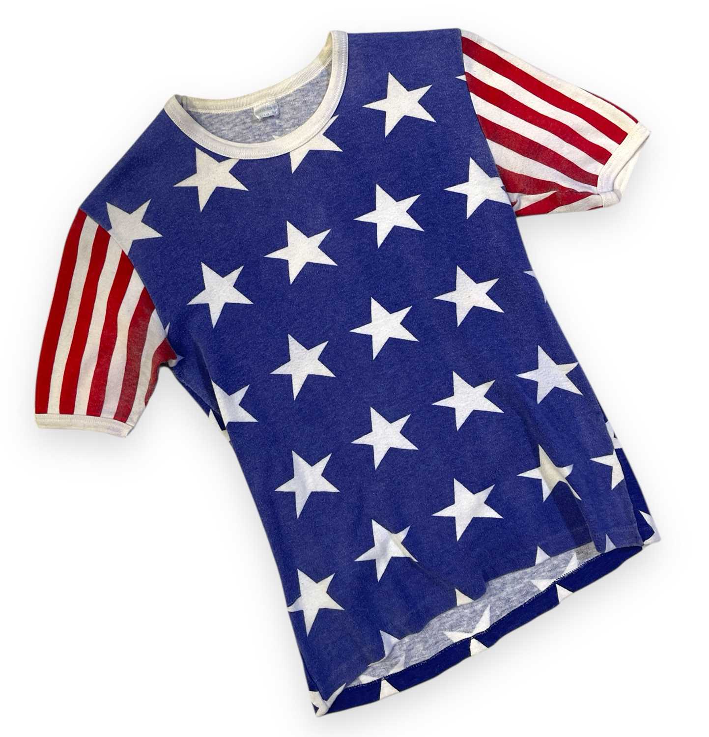 Lot 545 - QUEEN - A STARS AND STRIPES T-SHIRT OWNED AND WORN BY FREDDIE MERCURY.