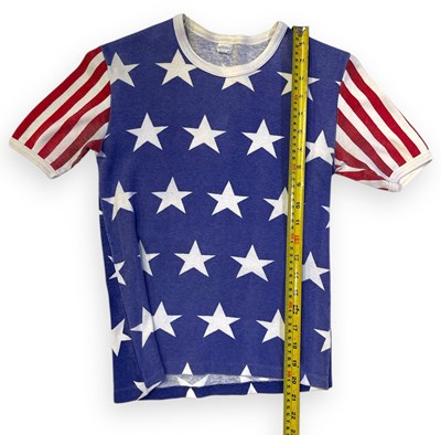 Lot 545 - QUEEN - A STARS AND STRIPES T-SHIRT OWNED AND WORN BY FREDDIE MERCURY.