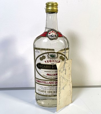 Lot 76 - STATUS QUO - VINTAGE BOTTLE OF TEQUILA WITH BAND SIGNED GIFT TAG.