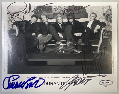 Lot 289 - DURAN DURAN - SIGNED 8X10" PHOTO.
