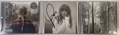Lot 303 - TAYLOR SWIFT- THREE SIGNED CDS.