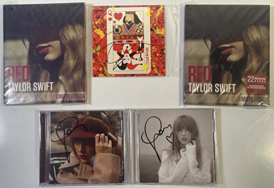 Lot 304 - TAYLOR SWIFT / ED SHEERAN - SIGNED CDS.