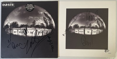 Lot 494 - OASIS - SIGNED COPY OF DON'T BELIEVE THE TRUTH WITH SIGNED ART PRINT.