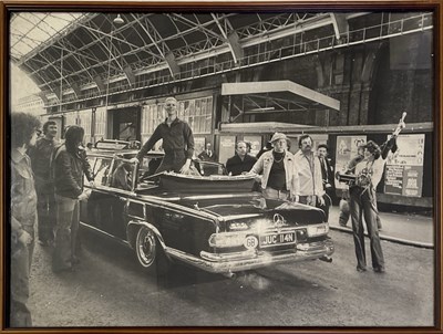 Lot 580 - DAVID BOWIE - LARGE PHOTO PRINT OF BOWIE IN A MERCEDES, LONDON, 1976