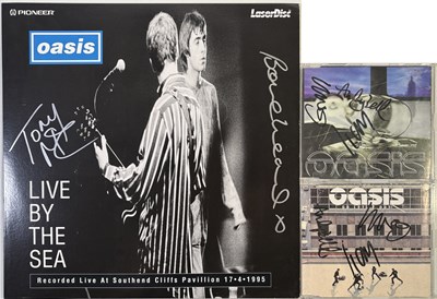 Lot 512 - OASIS - SIGNED CD SINGLES.