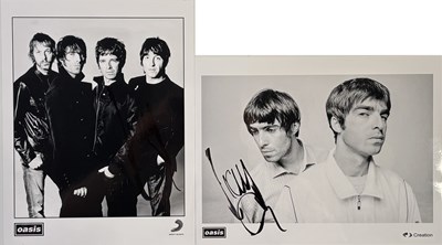 Lot 513 - OASIS - PROMOTIONAL PHOTOS SIGNED BY LIAM GALLAGHER.
