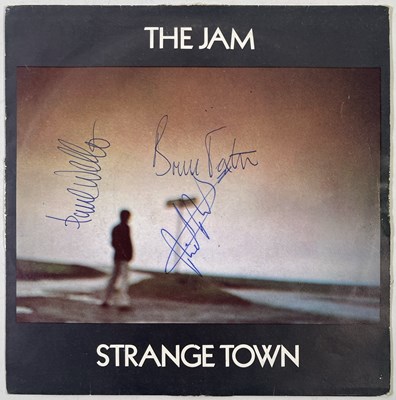 Lot 424 - THE JAM - SIGNED COPY OF 'STRANGE TOWN'.