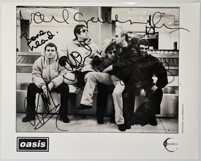 Lot 609 - OASIS - FULLY SIGNED CREATION PROMO PHOTO.