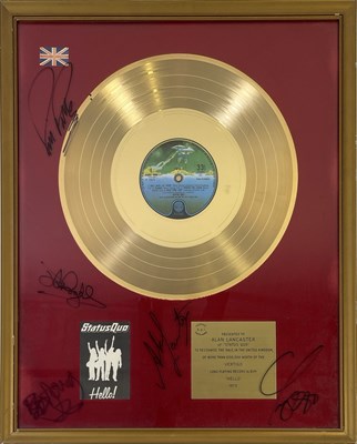 Lot 516 - STATUS QUO - FULLY SIGNED OFFICIAL BPI GOLD DISC AWARD PRESENTED TO ALAN LANCASTER.