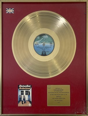 Lot 517 - STATUS QUO - BPI GOLD DISC PRESENTED TO ALAN LANCASTER FOR 'ON THE LEVEL'.